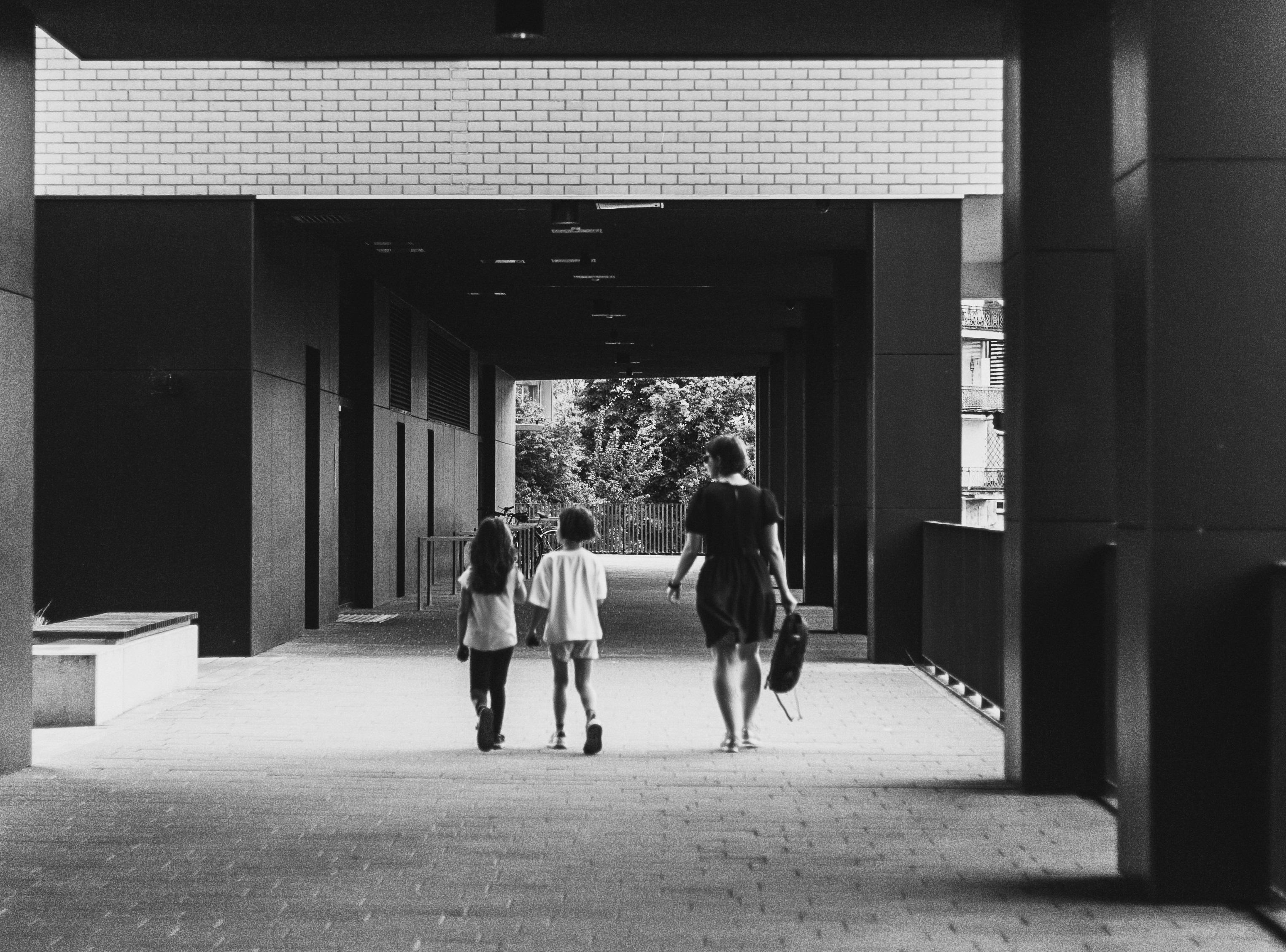 Woman walking with 2 children