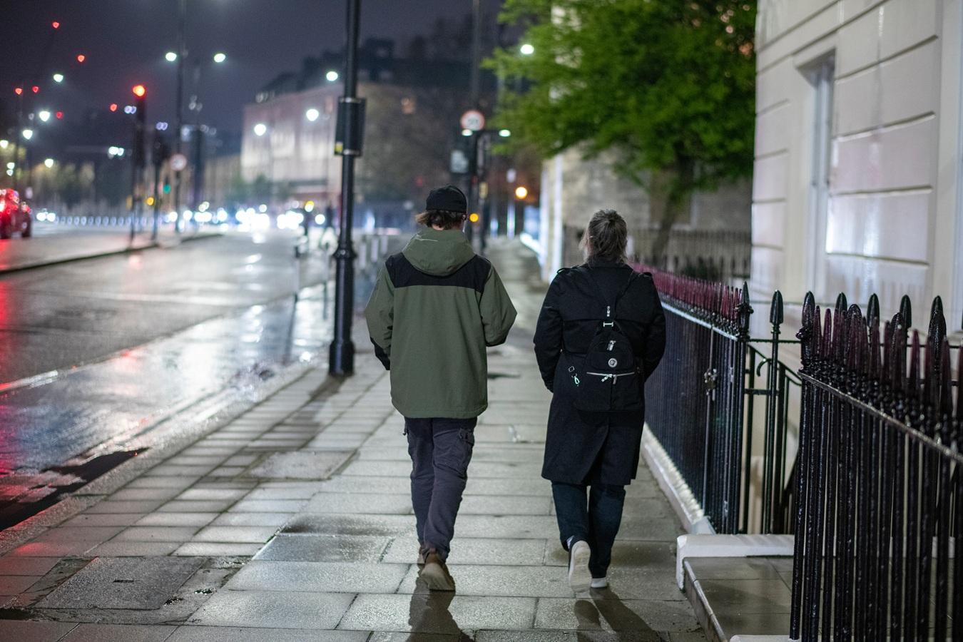 Teenagers walking at night
